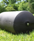 270 Lb Push And Tow Poly Lawn Roller With Easy Turn Tethered Plug 18 By 24 Inch Flat Black Heavy Duty Drum on grass