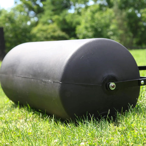 270 Lb Push And Tow Poly Lawn Roller With Easy Turn Tethered Plug 18 By 24 Inch Flat Black Heavy Duty Drum on grass