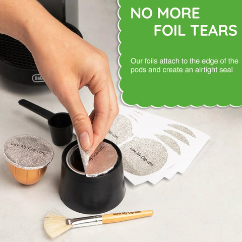 Person placing reusable aluminum lid on VertuoLine capsule; features 100 pack foil seals for Nespresso Vertuo pods.