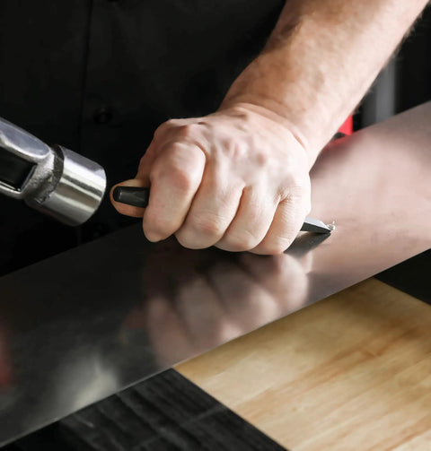Heavy Duty Built To Last Pro Grade 16 Piece Punch And Chisel Set With Roll Pouch in use on metal surface by hand