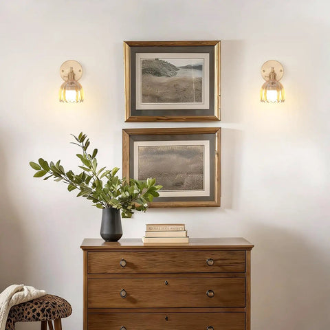 Vintage Rechargeable Wall Sconce Set With Amber Tulip Glass Shade And Wireless Remote For Zero Wiring Bedroom Decor installed beside framed art.