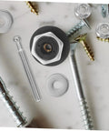 Dope Push Button Hood Pin Latch Kit For Cars with screws and washers on marble surface