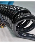 Heavy Duty Retractable Spiral Cable 18 Core Telescopic Power Cord Stretches Up To 15 Meters with tough plastic housing.