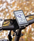 Universal 5 Pin LCD Display Meter for E Bikes and Scooters mounted on handlebars showing speed and energy levels.