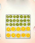 Top Shelf 1000W Food Dehydrator With 8 Spacious Trays And Smart Digital Controls displaying sliced kiwi and oranges.