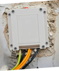 55A Compact ABS Electrical Distribution Enclosure For Control Panels Weatherproof Box installed with cables in wall