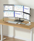 Dual Monitor Arm Mount With Smooth As Butter Articulation Full Extension Swivel Tilt Rotation Height Adjustable Heavy Duty Steel Desk Stand Ergonomic Desktop Setup For 17 To 32 Inch Screens Built Like A Tank with four monitors on a wooden desk.