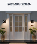 Motion Sensor Outdoor Wall Light With Adjustable Swivel Lamp Head LED Exterior Porch Light next to white door, illuminating entrance.