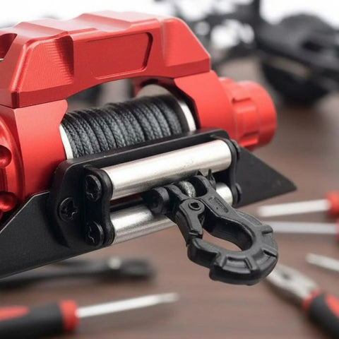 Close-up of Heavy Duty 1/10 Scale CNC Metal Electric Winch For RC Crawler Cars showing steel cable and hook.
