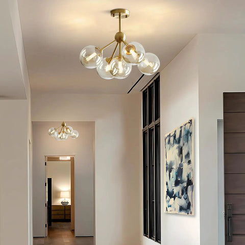 5 Light Amber Glass Globe Chandelier With Brass Gold Finish, Semi Flush Mount Ceiling Light in a modern hallway