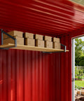 Heavy Duty 4 Pack Shipping Container Shelf Brackets Rock Solid Steel Rack Supports With Reinforced Stabilizer Bar For Garage Storage And Workshop Shelving. Black steel brackets supporting wooden shelf with boxes.