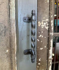 Set Of 2 Oversized Cast Iron Door Pull Handles With Twisted Forged Design for a rustic exterior door