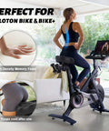 Woman using Peloton with oversized extra wide bike seat for women and men, all day comfy saddle with memory foam and cooling gel.