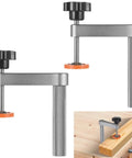 Two Pack Aluminum Bench Dog Clamps for Three Quarter Inch Dog Holes with hand operated knob adjustment securing wood piece