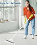 Person using 2 In 1 Floor Scrub Brush With 48 Inch Adjustable Handle And Built In Scraper For Tile Shower Tub Deck And Garage Cleaning Stiff Bristle Floor Scrubber For Heavy Duty Grime on bathroom floor.