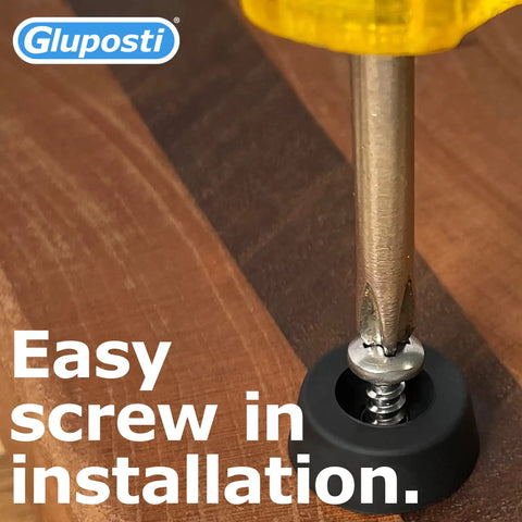 Close-up of screwdriver installing 12 Pack Rubber Feet For Cutting Boards Non Slip Bumper Pads With Stainless Screws And Inserts on wood surface.
