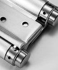 Close-up of Commercial Grade Double Action Swing Door Hinges with Auto Close, Heavy Duty Stainless Steel 201, Brushed Finish