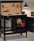 Boss Level Multipurpose Workbench With Lockable Storage Cabinet And Slide Drawer in a workshop setting, tools displayed on the pegboard.