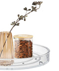 Two Pack Clear Lazy Susan Turntable Organizer For Kitchen Cabinets And Countertops with vase and jar of nuts