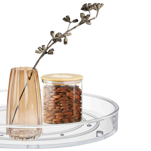 Two Pack Clear Lazy Susan Turntable Organizer For Kitchen Cabinets And Countertops with vase and jar of nuts