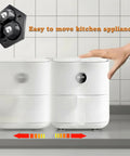 Eight Pack Countertop Appliance Sliders With Self Adhesive Rollers For Coffee Makers Air Fryers Stand Mixers And Blenders 360 Degree Rotating Mini Sticky Wheels With Stainless Steel Balls Black in use on counter in kitchen.