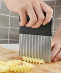 Front view of an Amazon stainless steel crinkle cutter with a black handle for slicing potatoes into crinkle fries.