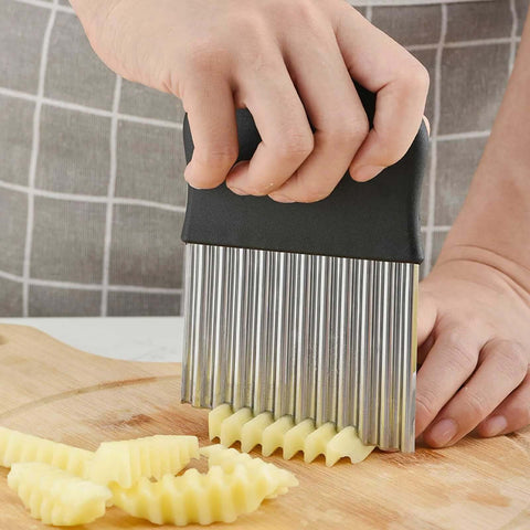 Front view of an Amazon stainless steel crinkle cutter with a black handle for slicing potatoes into crinkle fries.