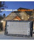 JUDYSSY 50W 100W 150W Outdoor Led Floodlight Ip65 Waterproof Spotlight on display in rain, suitable for outdoor lighting.