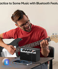 Man playing guitar with 10W Mini Guitar Amp Portable Practice Amplifier With Rechargeable Battery Clean And Drive Channels Dual 5W Speakers