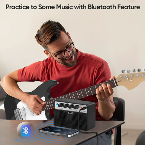 Man playing guitar with 10W Mini Guitar Amp Portable Practice Amplifier With Rechargeable Battery Clean And Drive Channels Dual 5W Speakers