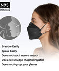 Woman wearing KN95 Face Masks 50 Pack for Adults and Teens, Soft And Comfy Disposable Masks With Up To 95 Percent Filtration, Black 3D Ergonomic Design For Secure Fit And Everyday Protection, side view.