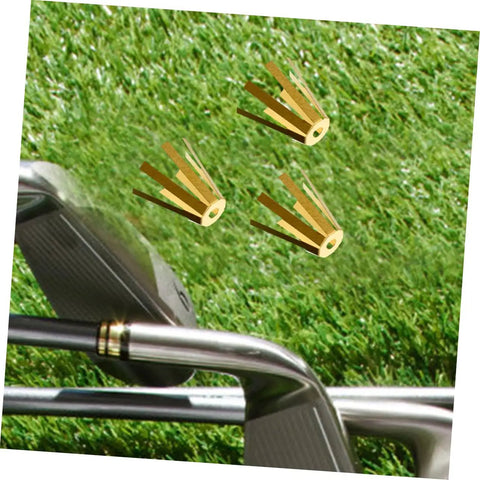 Universal Brass Golf Shaft Adapter Shims And Octopus Spacers Rig Ready Pack Of Five Durable Fittings displayed on grass near golf clubs.
