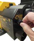 Man adjusting the settings on the Heavy Duty 4 By 36 Belt And 8 Inch Disc Sander With 7 Amp Motor for precision woodworking.