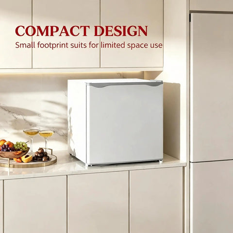 Slick Compact 1.1 Cu Ft Mini Freezer With Smooth Five Step Temperature Control And Reversible Door positioned in a modern kitchen.