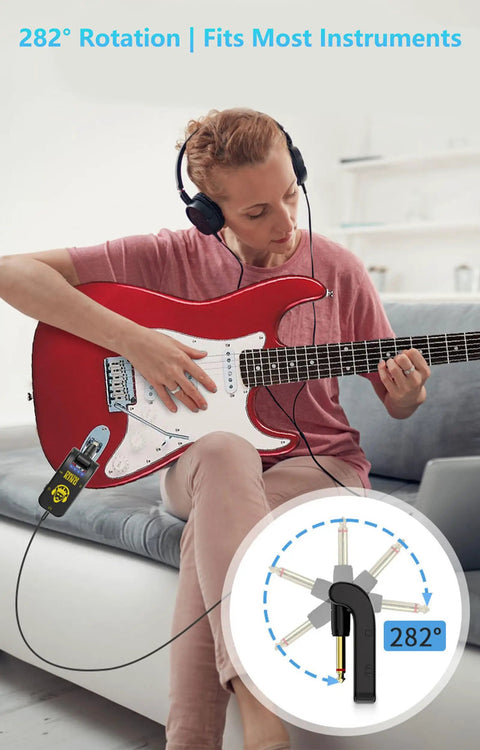 Musician using Compact 5W Guitar Headphone Amp With Built In DSP Distortion Timbre, red electric guitar, 282° rotation.