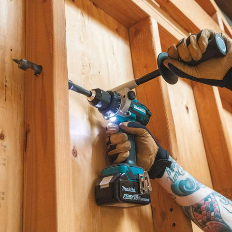 Hands using 18V LXT Brushless Cordless Hammer Drill And Impact Driver Combo Kit With 5.0Ah Batteries in wood drilling task