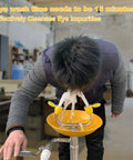Person using a Wall Mounted Eye Wash Station With Dual Nozzles And Internal Filtered Water For Fast Emergency Eye Wash And Eye Irrigation Simple To Use First Aid Gear For High Risk Worksites And Industrial Safety in a workshop.
