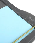 Close-up of ClassicCut Lite 12 Inch Guillotine Paper Cutter with alignment grid and sharp blade on sturdy plastic base.