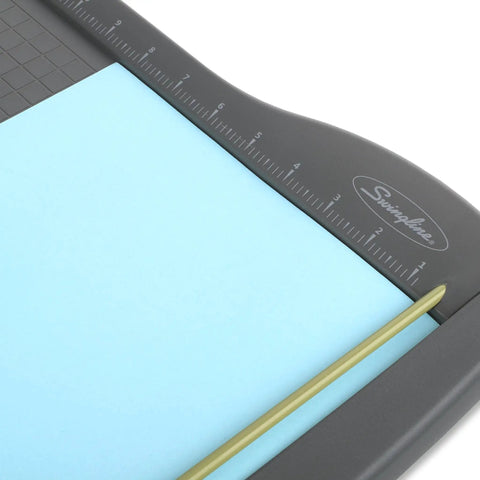 Close-up of ClassicCut Lite 12 Inch Guillotine Paper Cutter with alignment grid and sharp blade on sturdy plastic base.