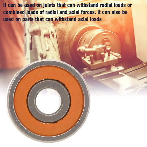 Top Shelf Smr148 Hybrid Ceramic Fishing Reel Bearings 8X14X4mm resting on a gray background with an orange ring for smooth spinning.