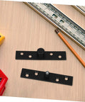 Black Rock Solid Heavy Duty Stainless Steel Pivot Hinges for hidden doors and bookcases on a wooden table with tools