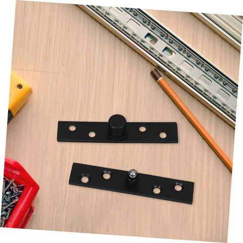 Black Rock Solid Heavy Duty Stainless Steel Pivot Hinges for hidden doors and bookcases on a wooden table with tools