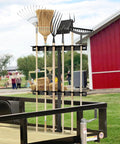 Beefy Trailer Tool Rack Shovel Holder With Six Tool Holes And Rubber Grommets, mounted on trailer, holding garden tools.