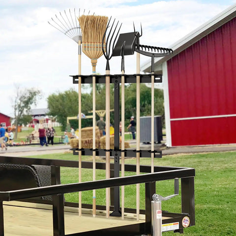 Beefy Trailer Tool Rack Shovel Holder With Six Tool Holes And Rubber Grommets, mounted on trailer, holding garden tools.