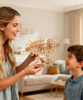 3D Wooden Puzzle Airship Kit For Adults And Teens Educational Brain Teaser Model Building Kit Premium Plywood Parts Easy To Assemble Tenon Joint Craft Hands On Fun Gift For Christmas Birthday Or Friends displayed by a woman and child in a living room.