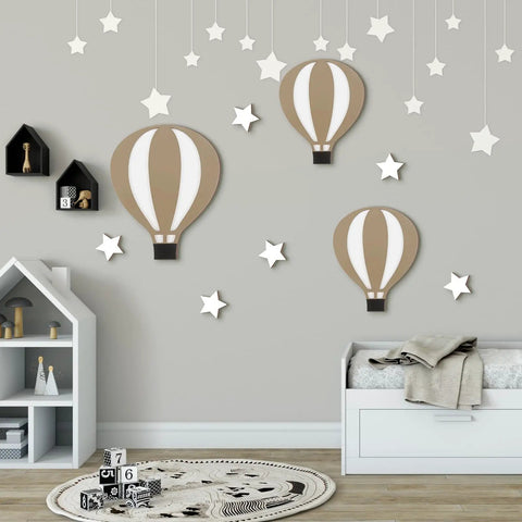 Nine Piece Boho Hot Air Balloon Nursery Wall Decor Kit With Wooden Signs And Star Shapes in nursery room setup
