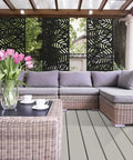 Outdoor patio with wicker furniture and 2x4 Black Outdoor Decorative Screen Panels Durable Polypropylene Weather Resistant with Low Thermal Expansion