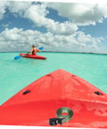 Heavy Duty Kayak Roof Rack Straps With Quick Buckles shown on red kayak in clear waters, clouds above.