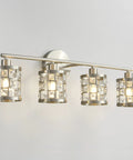 Four Light Brushed Nickel Vanity Light Over Mirror With Cylinder Crystal Shades, sleek modern wall sconces on white wall