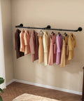 Wall Mounted Clothes Rack 72.5in Industrial Pipe Vibe Heavy Duty Detachable Iron Garment Bar in bedroom holding coats